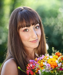 Naklejka premium Beautiful young girl in summer park