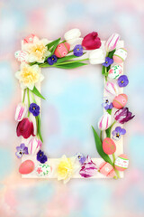Colorful Easter background border with decorated eggs and flowers on pastel blue pink sky cloud. Seasonal natural design for the holiday with white frame.