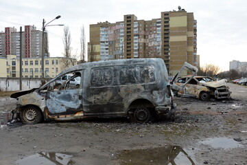KYIV, UKRAINE - 20231229: Cars lie wrecked in the parking lot following a Russian missile strike on December