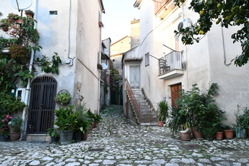 A narrow street between the old houses of Caiazzo, a medieval village in the province of Caserta, Italy.