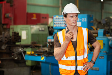 engineer or worker talking on walkie talkie in the factory
