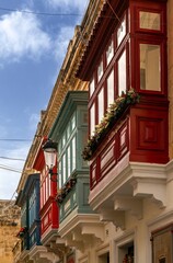 Fototapeta na wymiar close-up view of colourful Gallarija balconies in the historic city center of Rabat