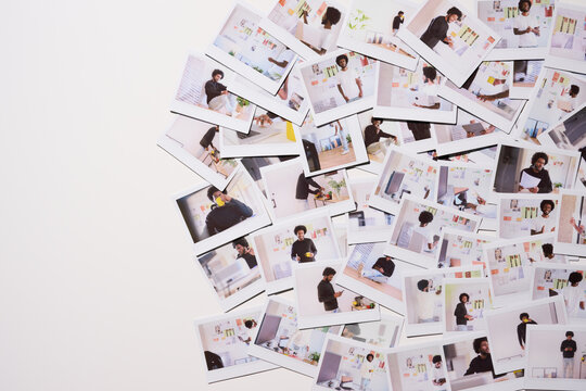 Creative Professional's Daily Journey. Scattered array of Polaroid photos captures the varied daily activities of a creative professional, from focused work to relaxed breaks