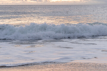 Atlantic Ocean waves crashing ashore onto the beach at Avon By The Sea, New Jersey on the New...