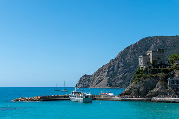 Monterosso, Italy, July 27, 2023. The castle and the tourist boat landing stage
