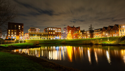 Scenic night view of illuminated buildings in the centre of the town of Waddinxveen, The Netherlands.