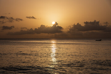 Paynes Bay Beach, Barbados: an amazing colorful sunset in the caribbean sea.