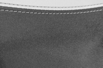 An interior view of a leather automobile seat. macro picture. ,natural suede leather background with an abstract texture
