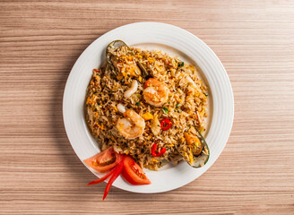 seafood fried rice with prawn, shrimp, seashell, egg and xo sauce served in dish isolated on table top view of hong kong food