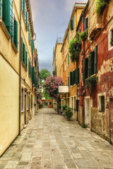 Narrow street in the old town in Venice Italy