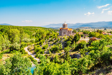 Dalmatia hinterland. Cetina river source and Orthodox church Dalmatian Zagora region of Croatia