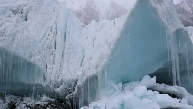 Huge ice blocks of the Khumbu glacier. The most dangerous place to climb Mount Everest in Nepal. An ice massif in the Himalayas