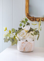 vase with flowers on the bathroom vanity, home decor
