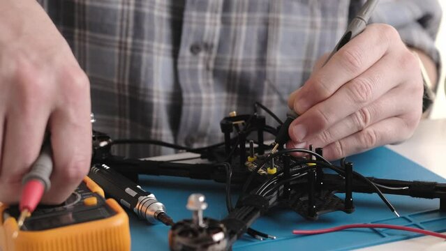 Masrter Cheching Circuit Connection On Microchip Board In Service Center, Hobby FPV Drone Assembling Process