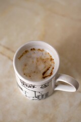cup of coffee with milk, spontaneous, real, homemade breakfast concept
