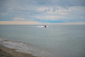 A boat sails on the black sea