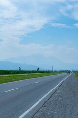 The road goes into the distance and the sky