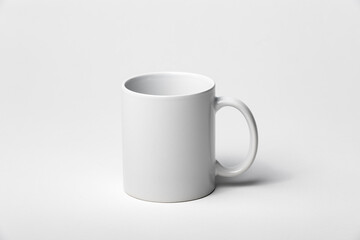 Mockup of a coffee cup or mug, white, isolated, on a plain background, ready to overlay designs or logos for merchandising