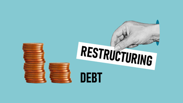 Debt restructuring is shown using the text. Collage with hand and coins