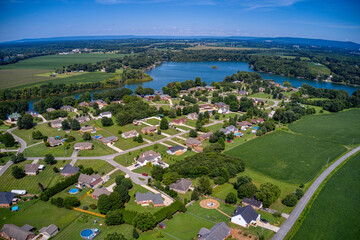 Aerial view of beautiful Lake and waterfront vacation homes, subdivision with mountain view on...