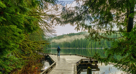 Walking the Sasamat Loop forest trail around beautiful Sasamat Lake in Belcarra Provincial Park in BC, Canada. © Andrew