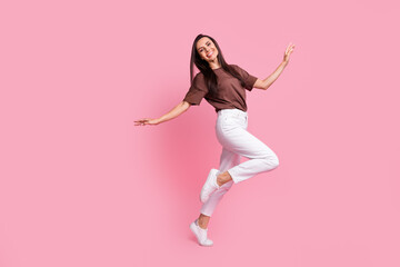 Full size profile portrait of carefree lovely girl dancing chill entertainment empty space isolated on pink color background - obrazy, fototapety, plakaty