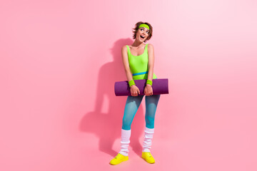 Photo of amazed sportswoman look empty space impressed pilates yoga trainings isolated pastel color background