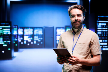 Portrait of technician making sure servers in cloud computing business service are correctly equipped, to provide redundancy and automatic failover of clusters to minimize failure of hardware