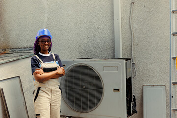 Portrait of cheerful knowledgeable professional proud of work done, standing in front of fixed hvac...
