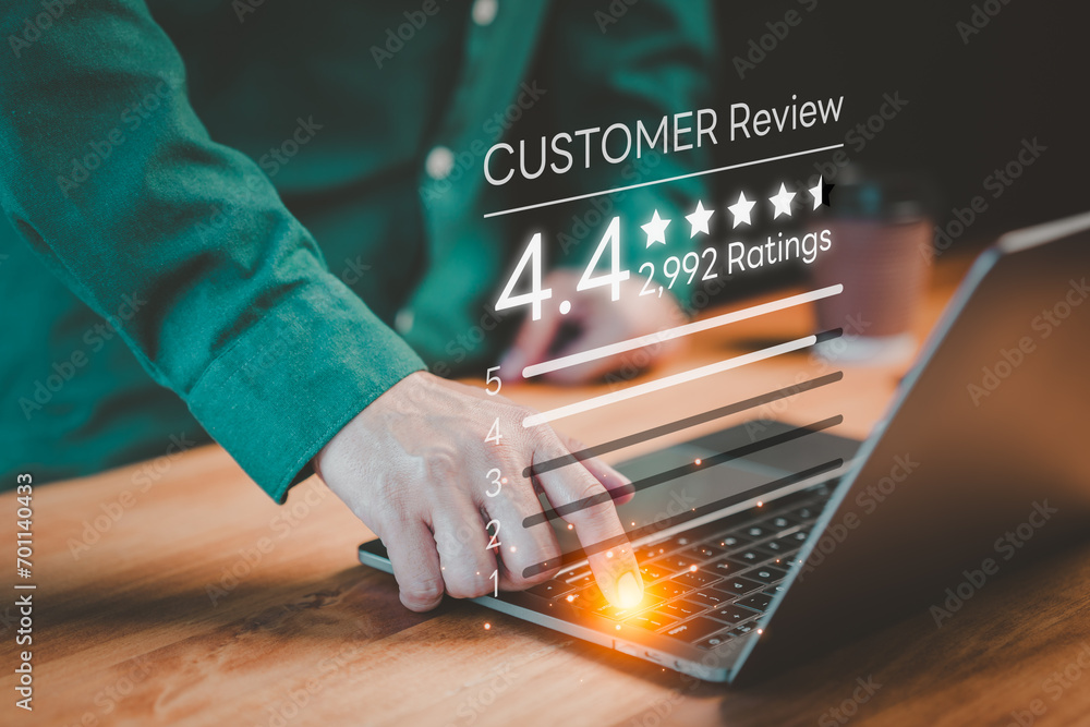 Poster customer using a computer laptop give ratings and point 4.4 stars icon for feedback review satisfact