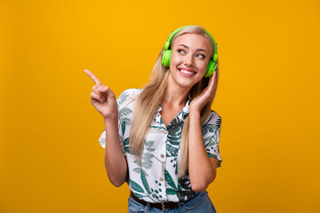 Portrait of nice woman with blond hair wear blouse touch earphones look directing at sale empty...