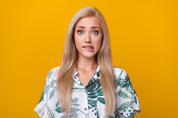 Photo of confused clueless pretty woman with straight hairdo dressed stylish print shirt biting...