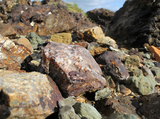 Close up of a group of rocks stones at a beach