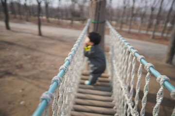 Swinging bridge kid