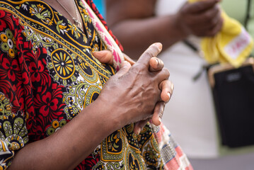 Hands of a religious person in prayer and peace.