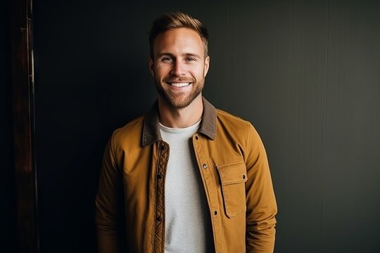 Portrait of a handsome young man smiling. Men's beauty, fashion.