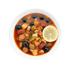 Meat solyanka soup with sausages, olives and vegetables in bowl isolated on white, top view