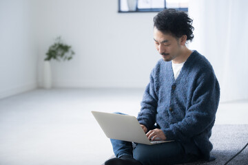 Close-up of bearded man operating computer Sitting