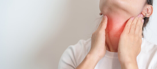 Woman checking Thyroid gland disease. Hand holding Neck pain. Hyperthyroidism, Hypothyroidism,...