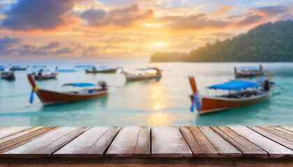 Perspective empty wooden table on top over blur Longtail boats on seashore at sunrise in summer background. Sea and clouds at Lipe island in Thailand. can be used mock up for montage products