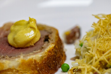 Traditional and Perfect homemade juicy Beef Wellington, tenderloin dish on rustic wooden table. Christmas food