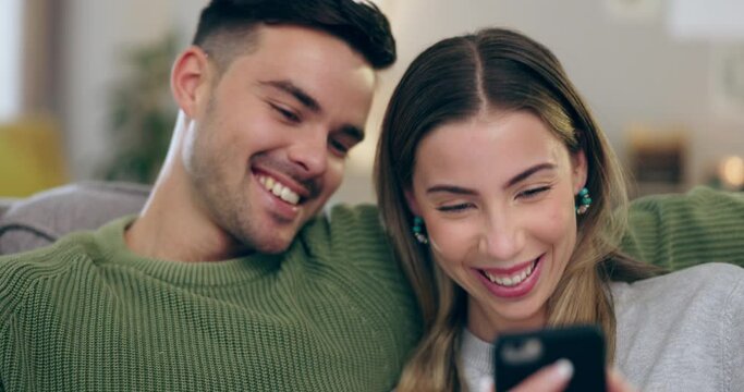 Laugh, funny and a couple with a phone on home sofa for connection, communication and meme. Young man and woman together on couch with a smartphone for internet, video or reading social media chat