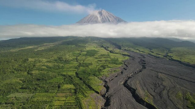drone flight over landcape of mount, volcano Semeru, Jawa. Indonesia. Sunny day with a clouds around volcano