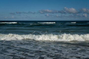 View of the incoming wave on the Baltic Sea on the shore of the Curonian Spit on a summer day, Kaliningrad region, Russia