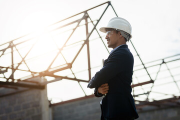 Portrait of cvil engineer with safety uniform working at construction site outdoor, Construction worker checking and controlling project on building site, Architecture engineering on new project