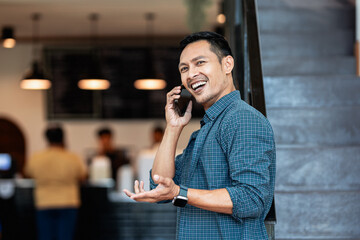 Restaurant, tablet and happy man or small business owner, e commerce and online cafe or coffee shop management. Waiter or asian person reading sales on digital technology or internet for his startup