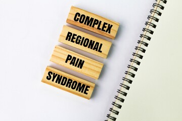 wooden arrangement with the words COMPLEX REGIONAL PAIN SYNDROME. disease or hospital concept. CRPS...