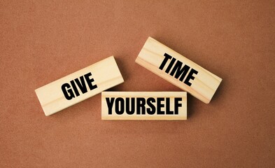 wood with the words give yourself time