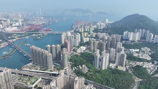 Tsuen Wan Kwai Chung and Tsing Yi ,a commercial and residential seaside satellite town, built on a bay in New Territories of Hong Kong, Aerial drone City skyview
