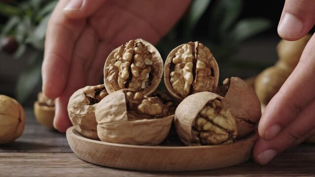 Walnuts are placed on a rustic old wooden table